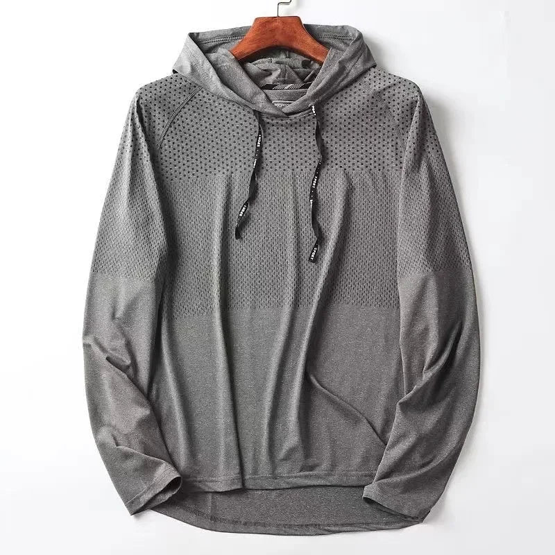 Men's gray athletic performance hoodie with seamless construction and moisture-wicking breathable fabric