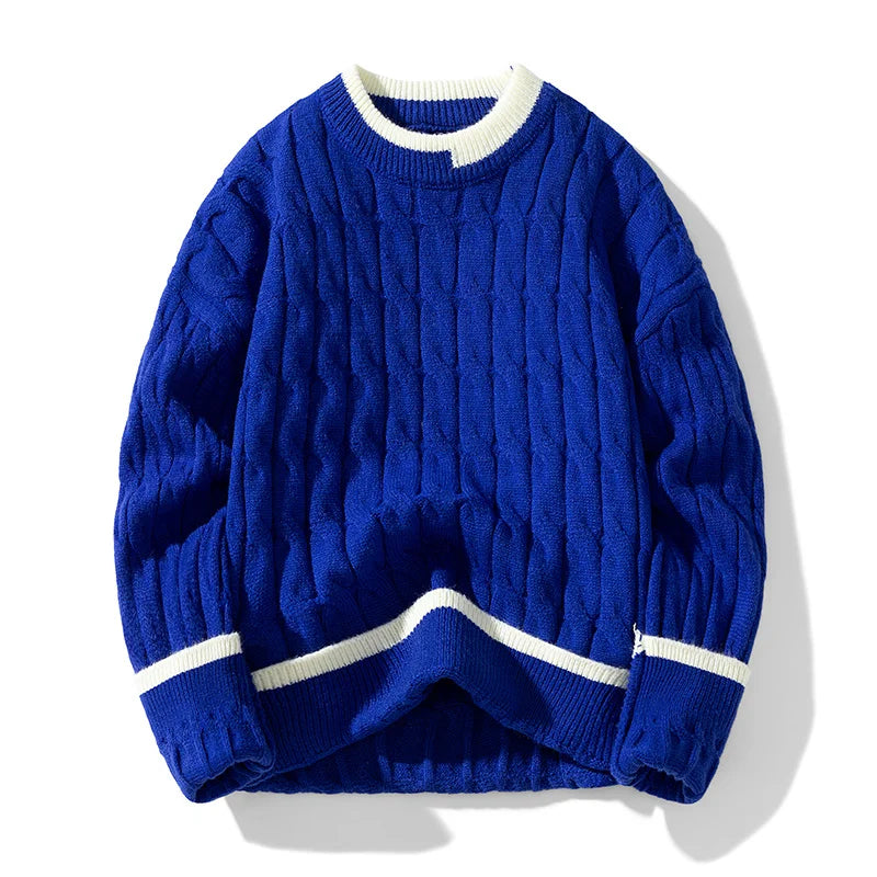 Ivory cable knit pullover sweater with patchwork design, relaxed fit, and ribbed edges
