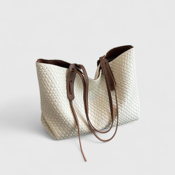 Classic woven tote bag with elegant pattern, spacious design, and long straps for work and leisure