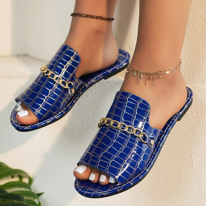 Women's croc-embossed sandals in neutral tone, sleek silhouette with quiet luxury texture