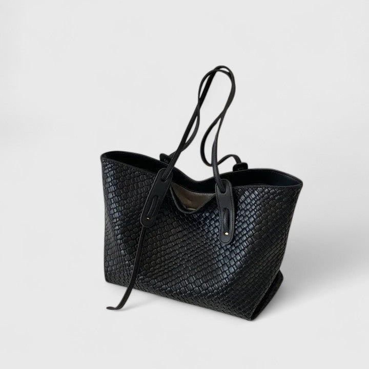 Classic woven tote bag with elegant pattern, spacious design, and long straps for work and leisure