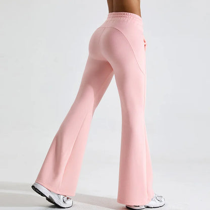 Black high-rise flared yoga pants in stretch performance fabric with body-contouring fit