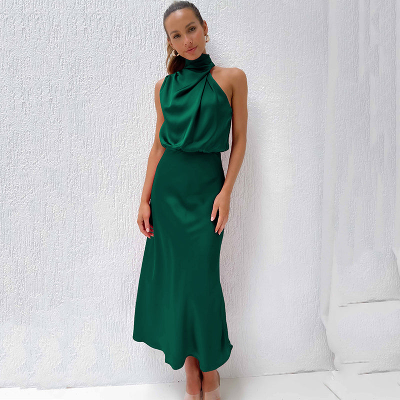 Sleek satin halter evening dress with flowing silhouette in elegant neutral tone