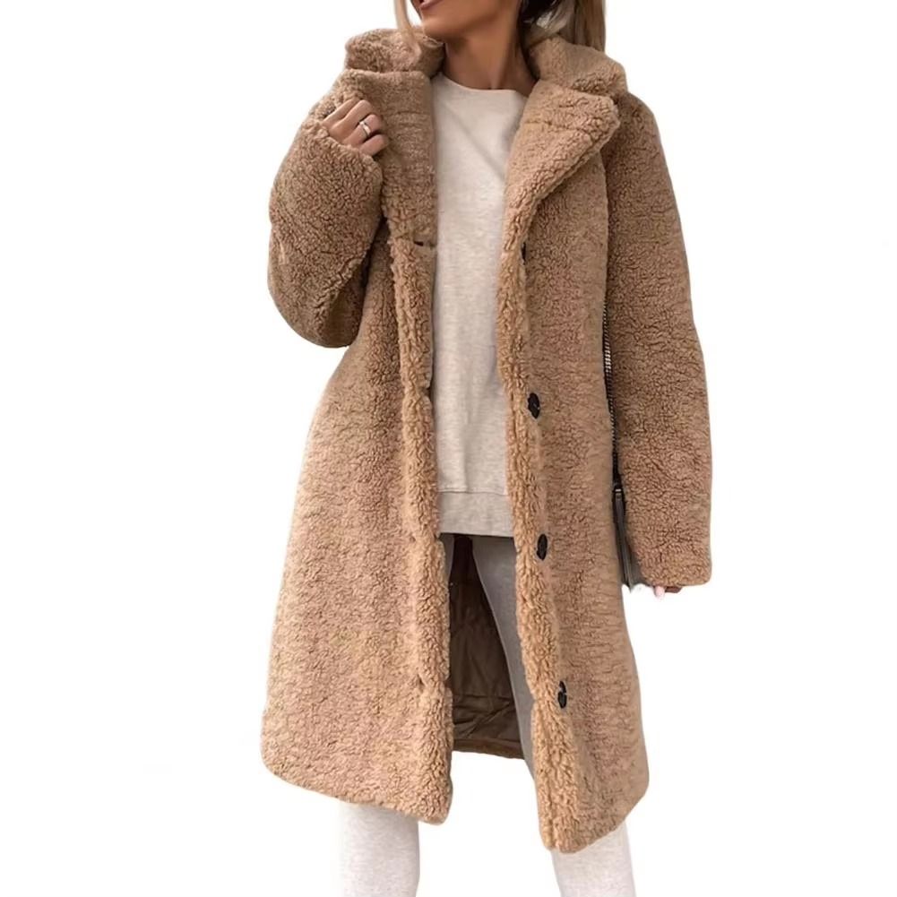Women's oversized teddy faux fur longline winter trench coat in plush high-pile texture for cozy warmth