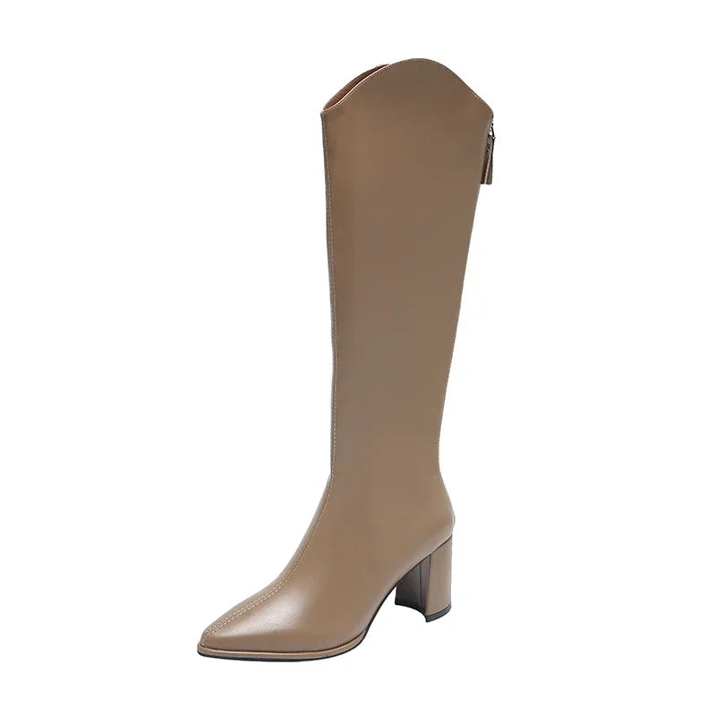 Women's knee-high heeled boots in sleek silhouette with mid-height block heel for polished everyday style