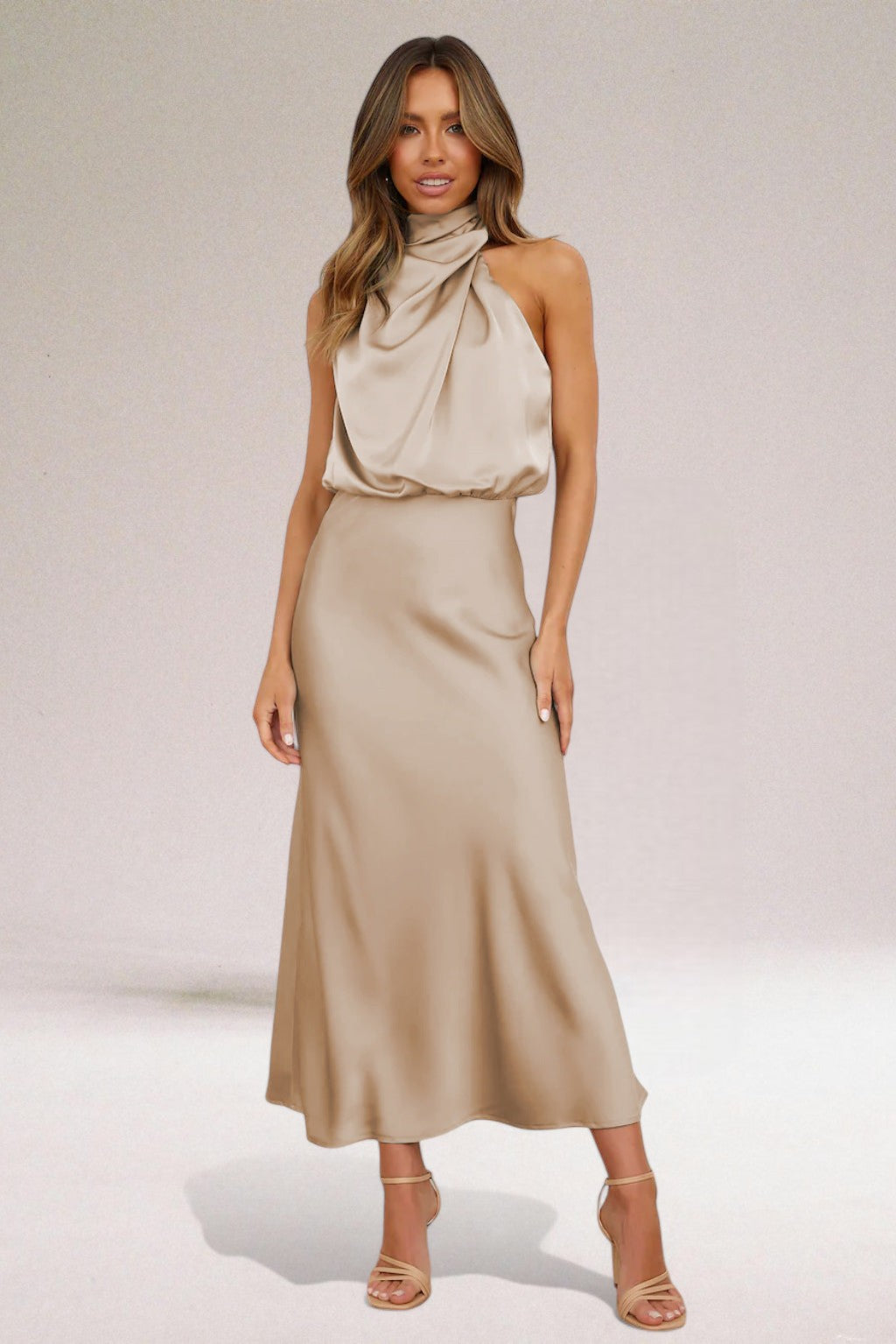 Elegant halter neck dress in sleek silhouette with radiant finish, designed for special occasions