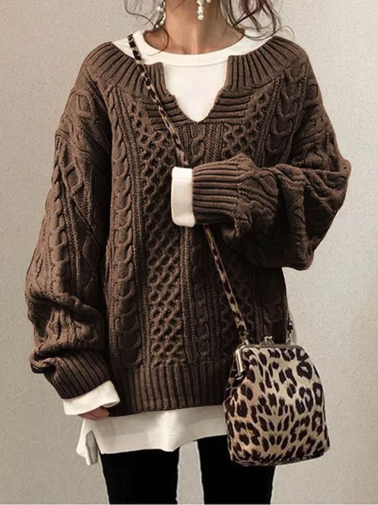 Women's cable knit sweater in cozy classic style featuring a flattering V-neck detail and rich textured pattern