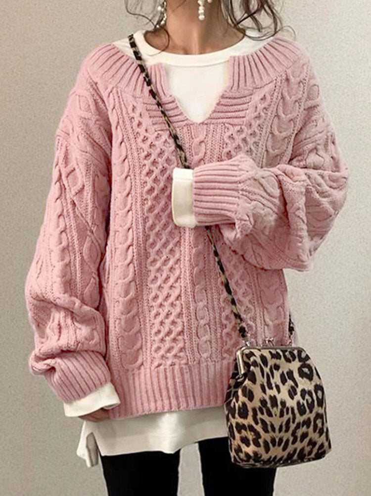 Women's cable knit sweater in classic cozy style featuring a flattering V-neck detail and textured pattern