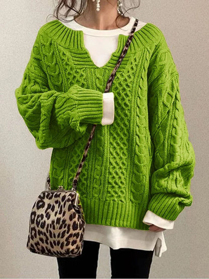 Women's cable knit sweater in classic cozy style featuring a flattering V-neck detail and textured pattern