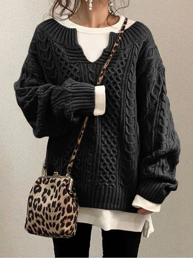 Women's cable knit sweater in classic style with V-neck detail and textured dimensional pattern