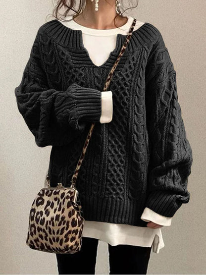 Women's cable knit sweater in classic style with V-neck detail and textured dimensional pattern