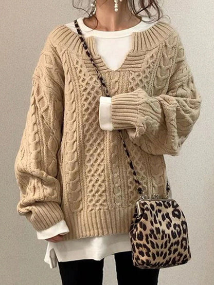 Women's cable knit sweater in classic cozy knitwear with feminine V-neck detail and textured pattern