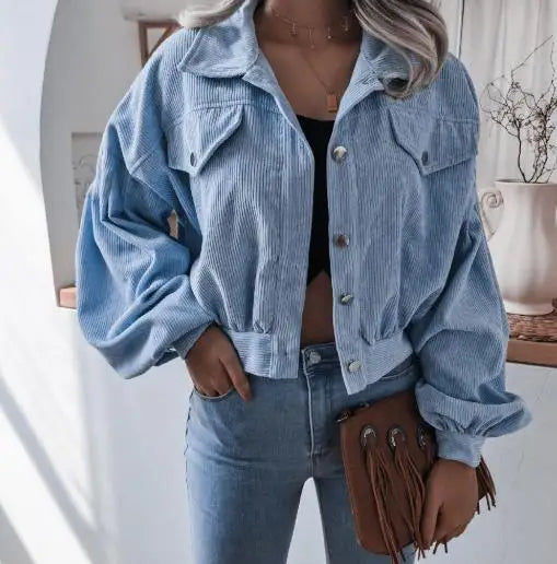 Cropped corduroy short jacket in warm neutral tone with plush texture and structured modern fit