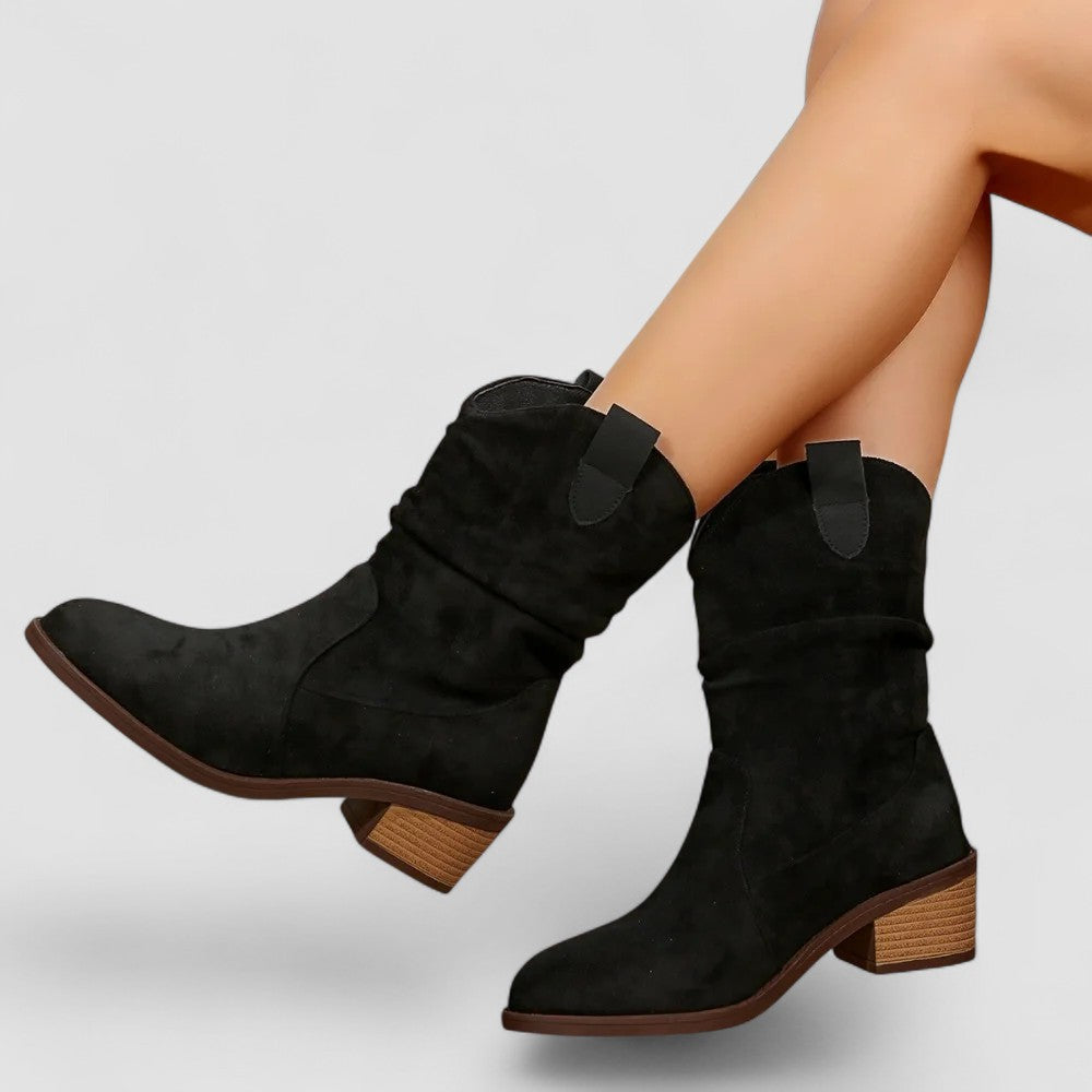 Black mid-calf boots sleek streamlined silhouette with contoured leg-lengthening design