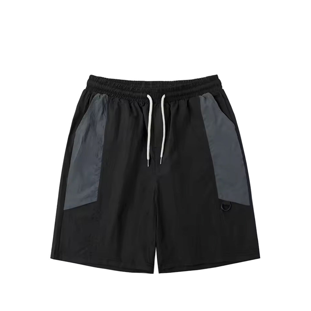 Neutral beige relaxed-fit nylon shorts with contrast panels, elastic waist, and subtle sheen
