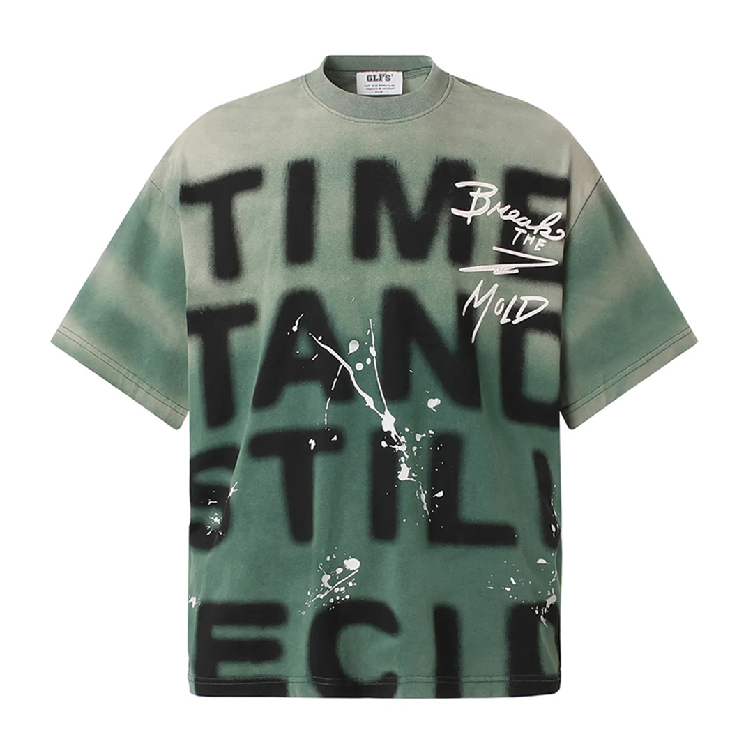 White loose fit graphic tee with bold paint-splatter print and garment-dyed soft-washed finish