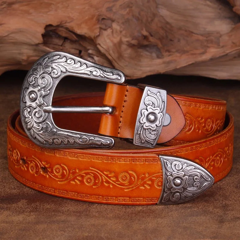Brown vegan leather western belt with intricate embossed designs and solid steel buckle