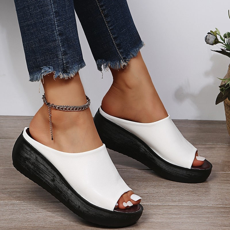 Women's cushioned slide sandals with buckle detail, slip-on style offering padded footbed comfort