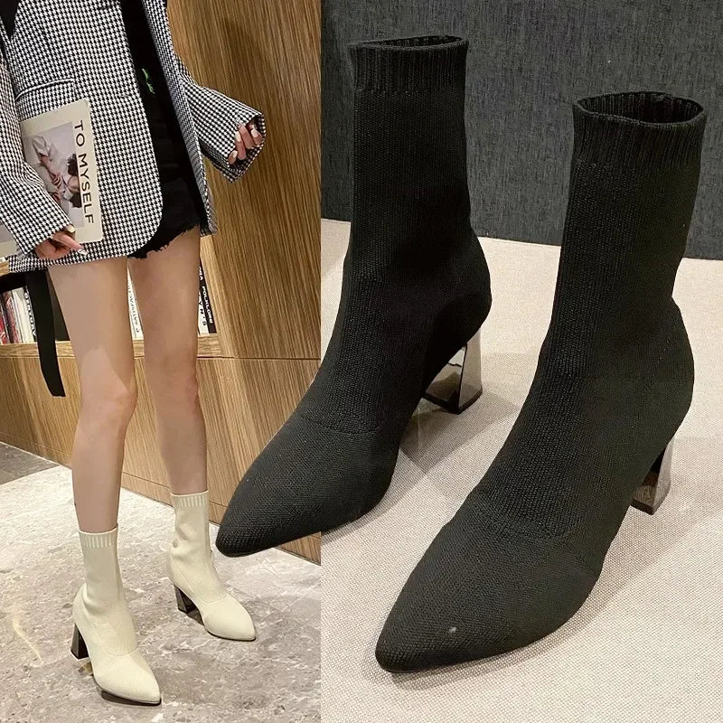 Women's black stretch sock-knit leather boots with pointed toe and comfort sole