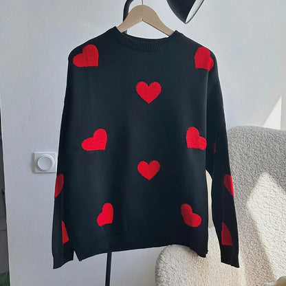Blush pink women's knit sweater with delicate heart print details, soft cozy feminine style