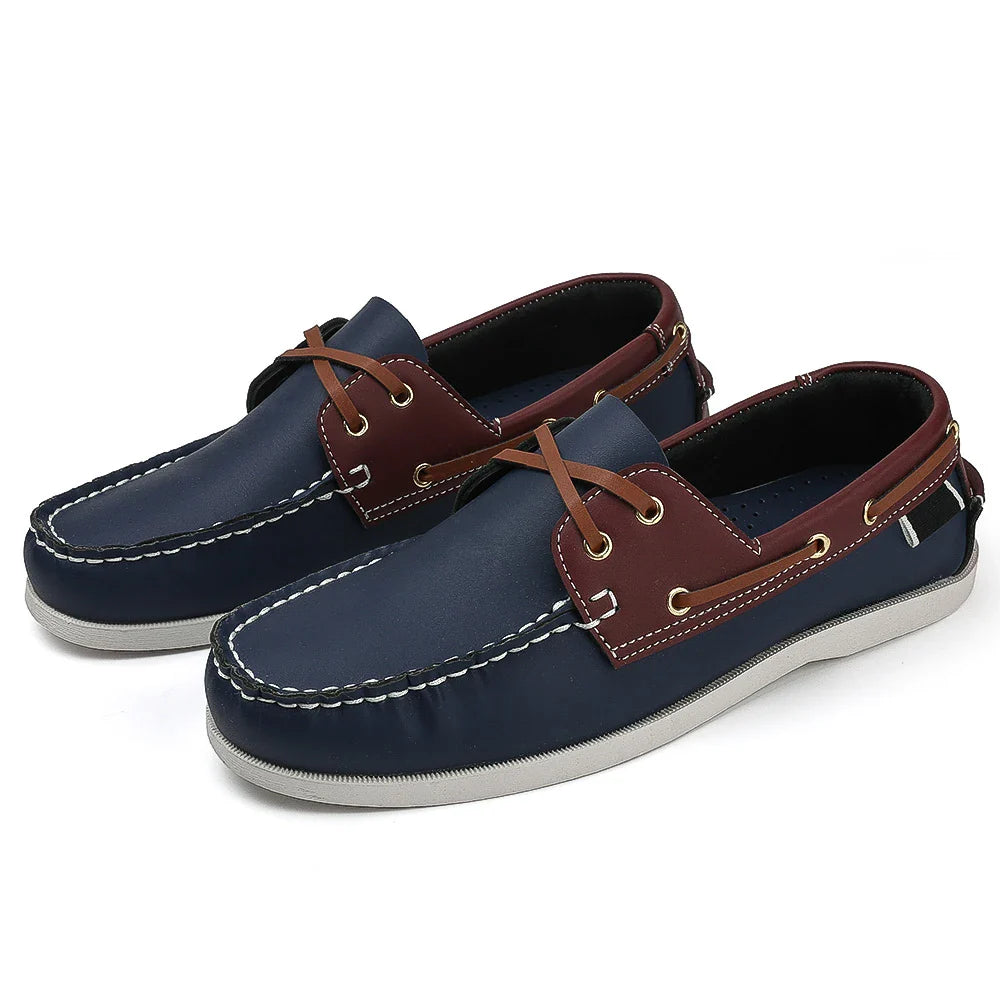 Men's navy two-tone slip-on boat shoes with synthetic leather upper and cushioned EVA foam sole