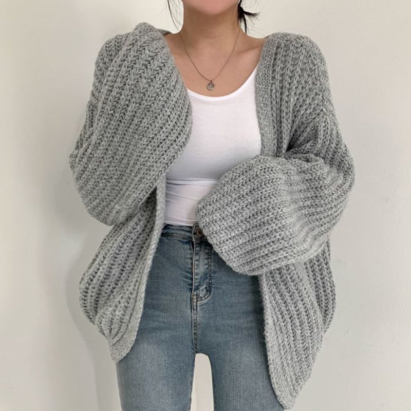 Women's oversized open front chunky ribbed knit cardigan in neutral tone with dropped shoulders