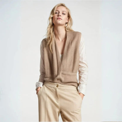 Neutral beige sleeveless belted wrap vest lightweight gilet with elegant drape and refined silhouette