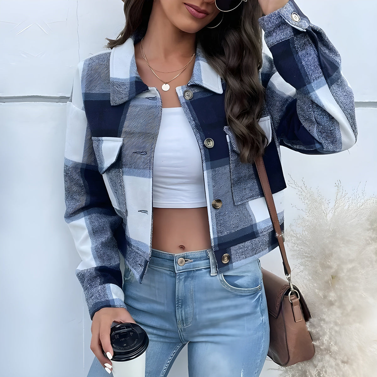 Cropped plaid-wash jacket with faux horn buttons, patch pockets, turn-down collar, and relaxed fit