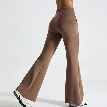Black high-rise flared yoga pants in stretch performance fabric with contoured fit