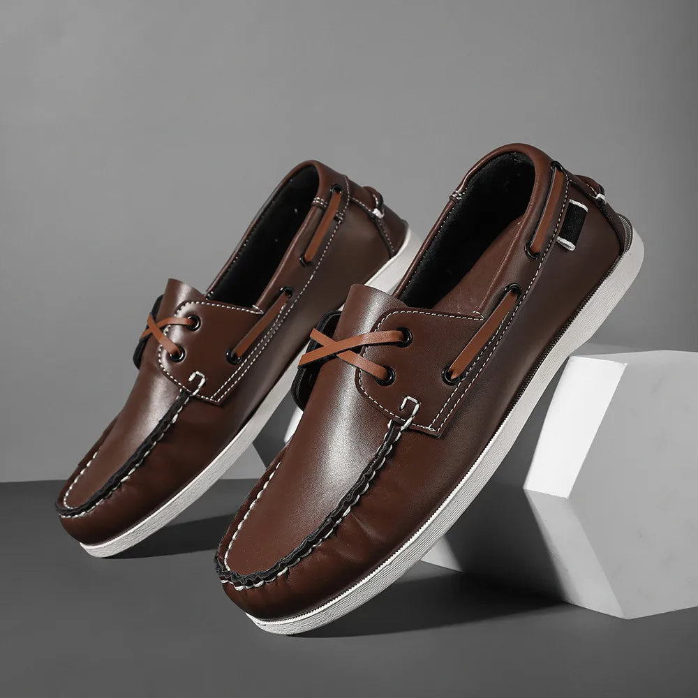 Men's navy two-tone slip-on boat shoes with leather upper and cushioned EVA foam sole