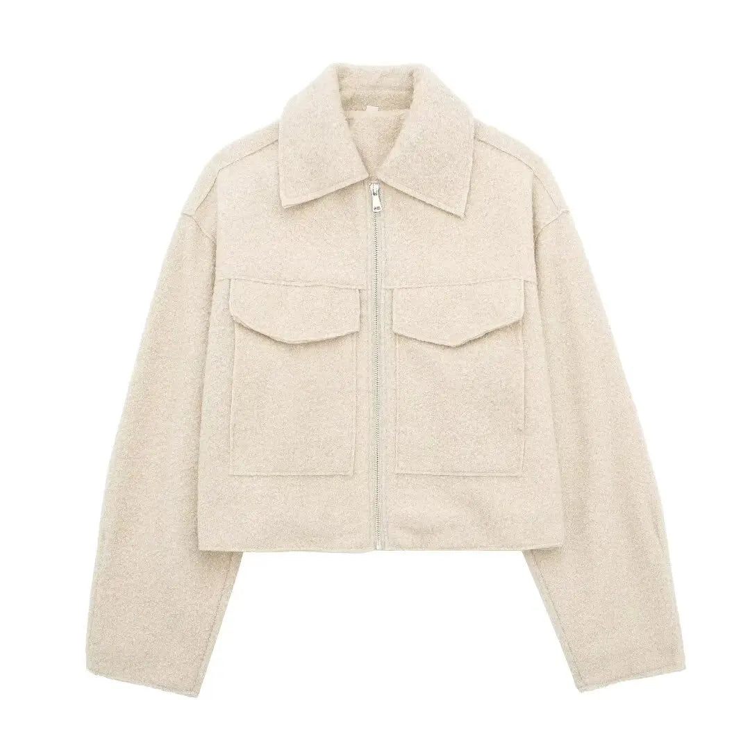 Black tailored urban jacket with front zipper, functional pockets, and vintage-inspired lapel collar
