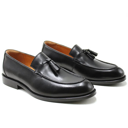 Men's black genuine leather slip-on loafers with tassel detail and sleek round-toe silhouette