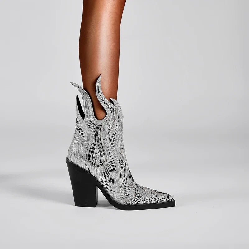 Black ankle boots with flame silhouette cutout shaft, rhinestone embellishments, bold diva style