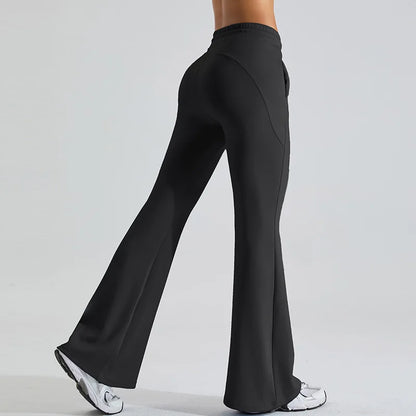 Black high-rise flared yoga pants with stretch performance fabric and body-contouring fit
