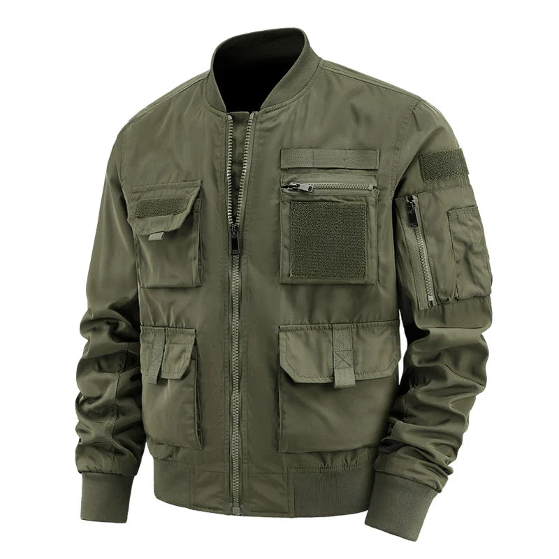 Men's dark utility jacket with multi-pocket velcro design, zippered compartments, and rugged outdoor styling