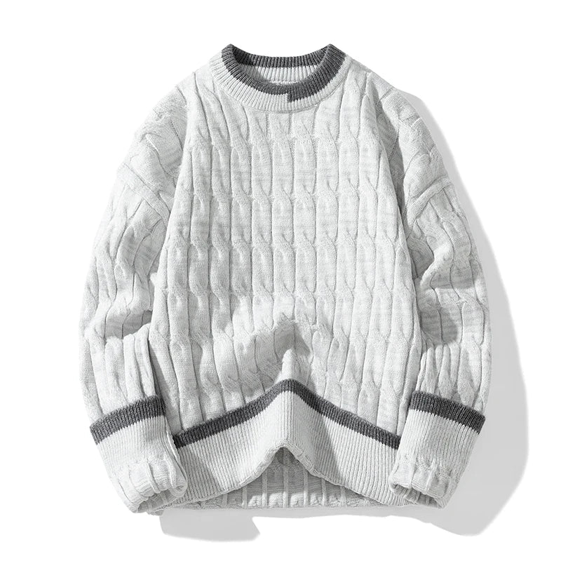Ivory cable knit pullover sweater with patchwork design, relaxed fit, and ribbed edges