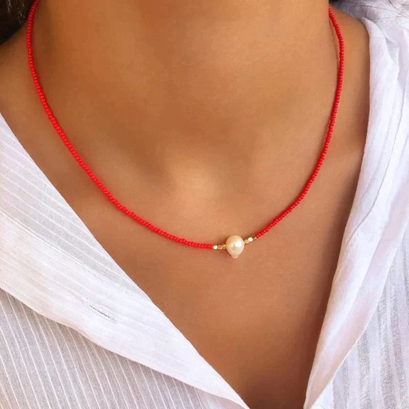 Minimalist pearl beaded choker necklace with single faux pearl centerpiece, choker-length fit