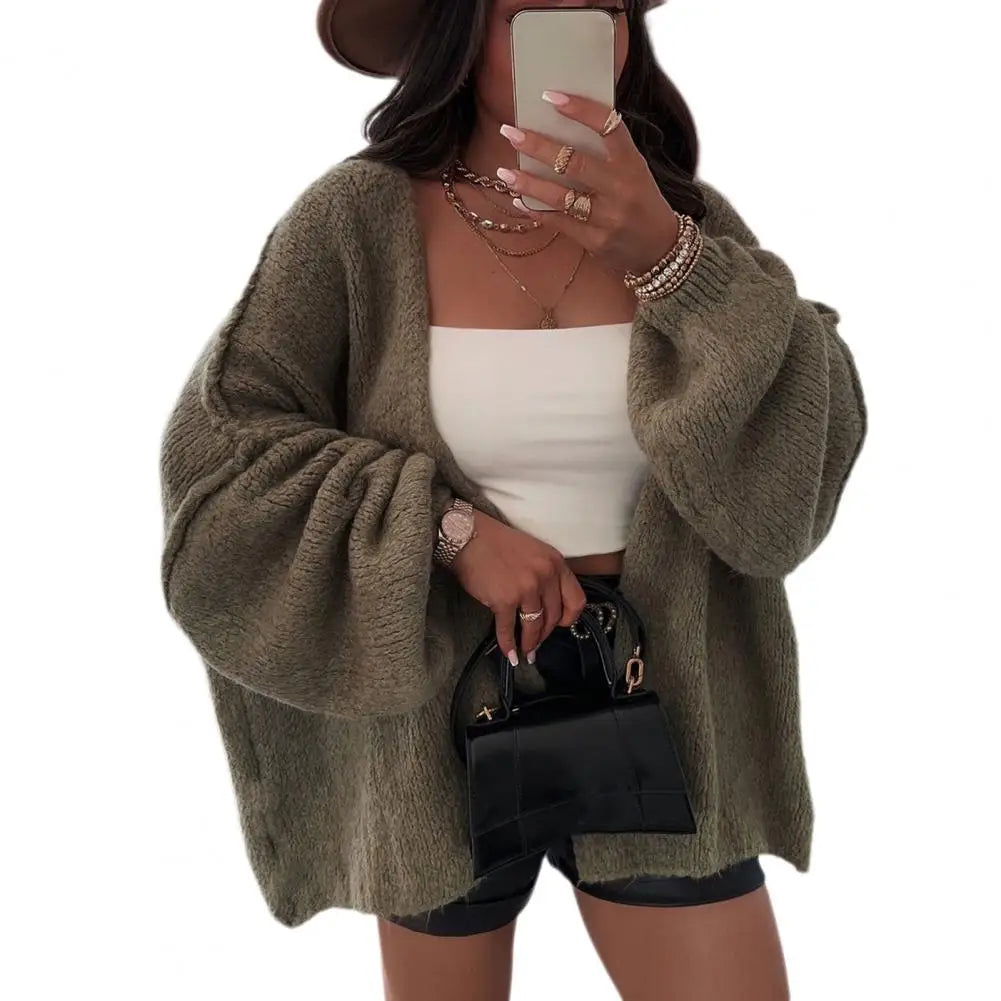 Beige oversized chunky knit cardigan with open front and relaxed draped fit