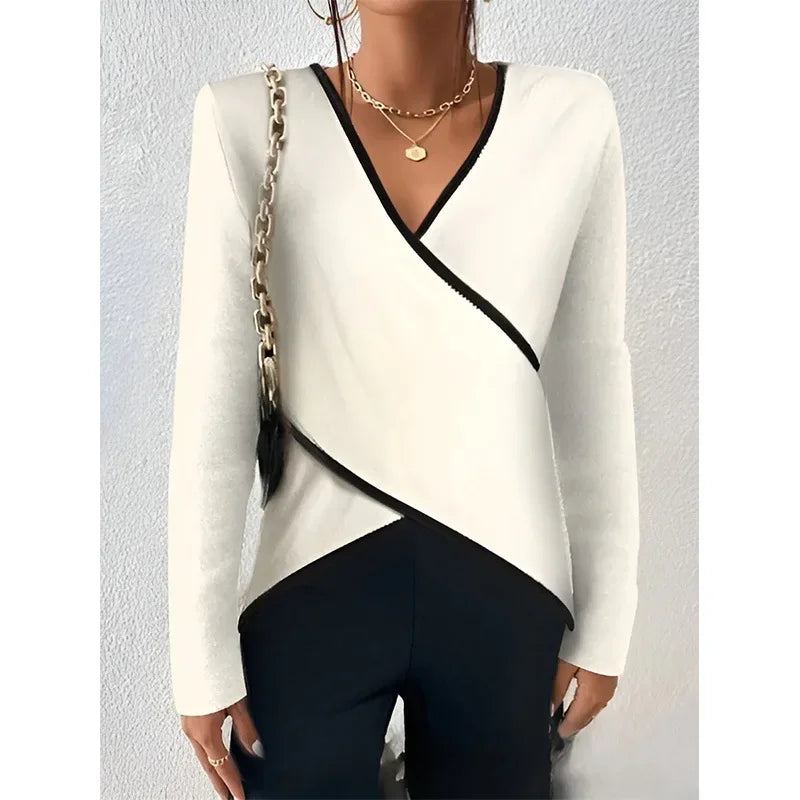 Women's brushed knit wrap blouse with contrast trim, sculpted silhouette and asymmetric hem