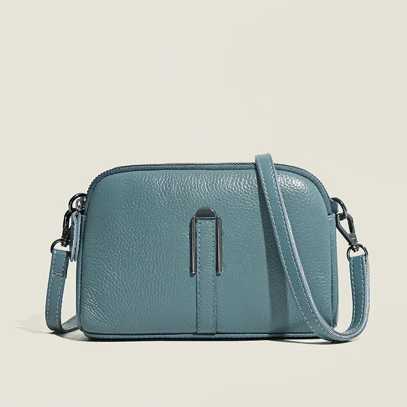 Elegant minimalist shoulder bag for women, compact structured silhouette with refined sophisticated style