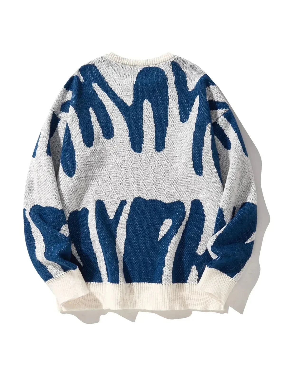 Oversized abstract knitted pullover in bold multicolor pattern, lightweight cotton-poly blend statement piece