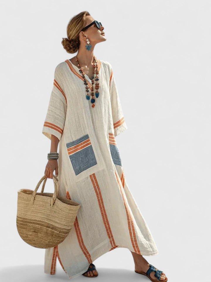 Women's white stripe kaftan maxi dress with deep V-neckline and flowing resort silhouette