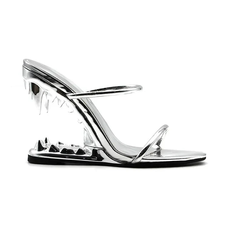 Black slingback heels with sculpted tiger teeth heel and gold chain detailing for bold evening style