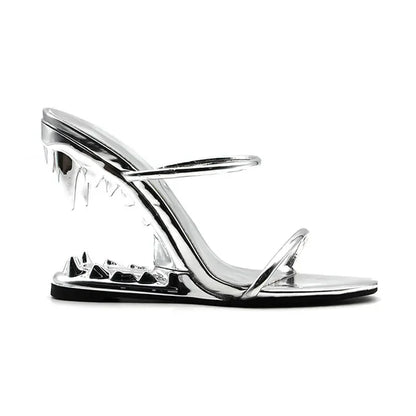 Black slingback heels with sculpted tiger teeth heel and gold chain detailing for bold evening style