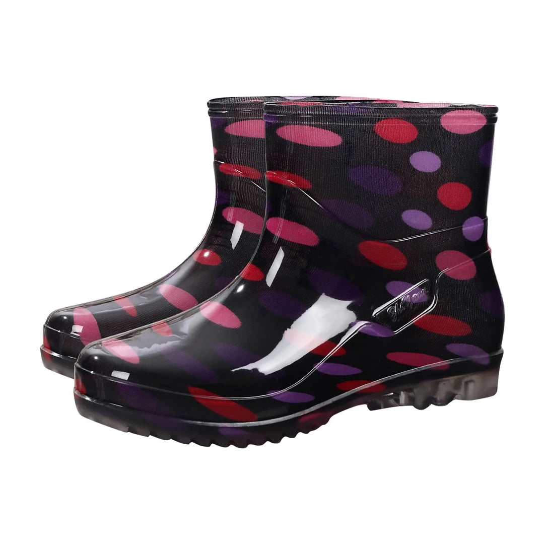 Women's waterproof rubber Wellington boots, slip-on mid-calf style with outdoor grip sole for rainy days