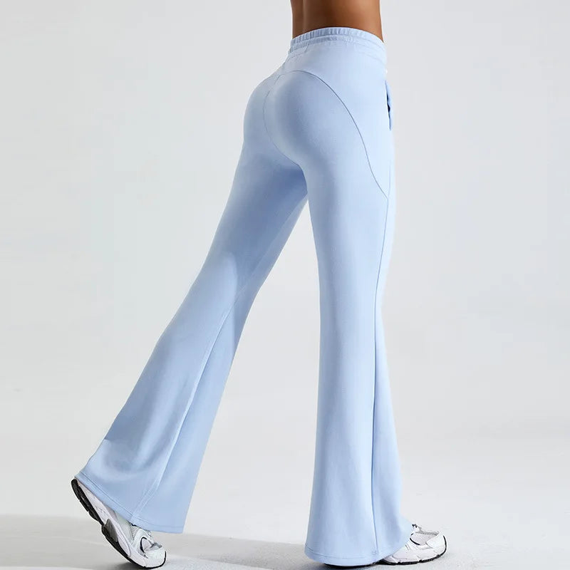 Black high-rise flared yoga pants in stretch performance fabric with contoured fit