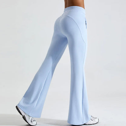 Black high-rise flared yoga pants in stretch performance fabric with contoured fit