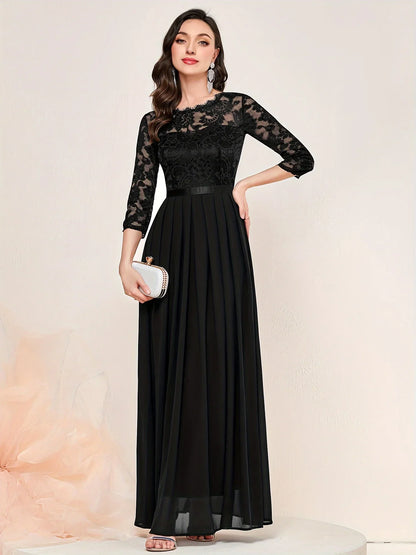 Black lace pleated formal evening dress with quarter sleeves and elegant overlay detailing