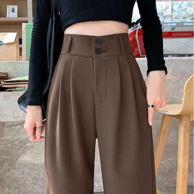 Black high-waist palazzo trousers with wide-leg drape and streamlined silhouette for women
