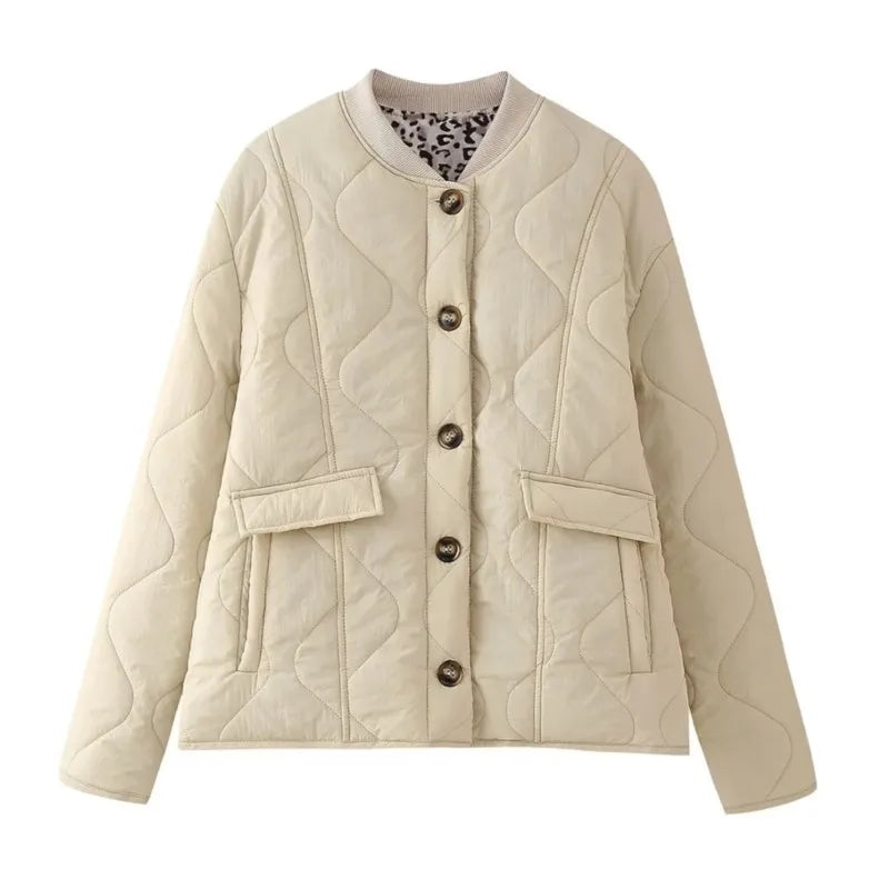 Black padded cotton jacket with leopard patchwork sleeves, quilted silhouette, street-ready style